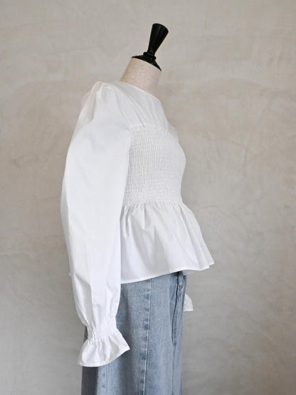 Smocked peplum blouse