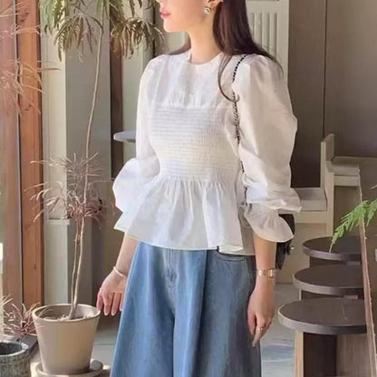 Smocked peplum blouse